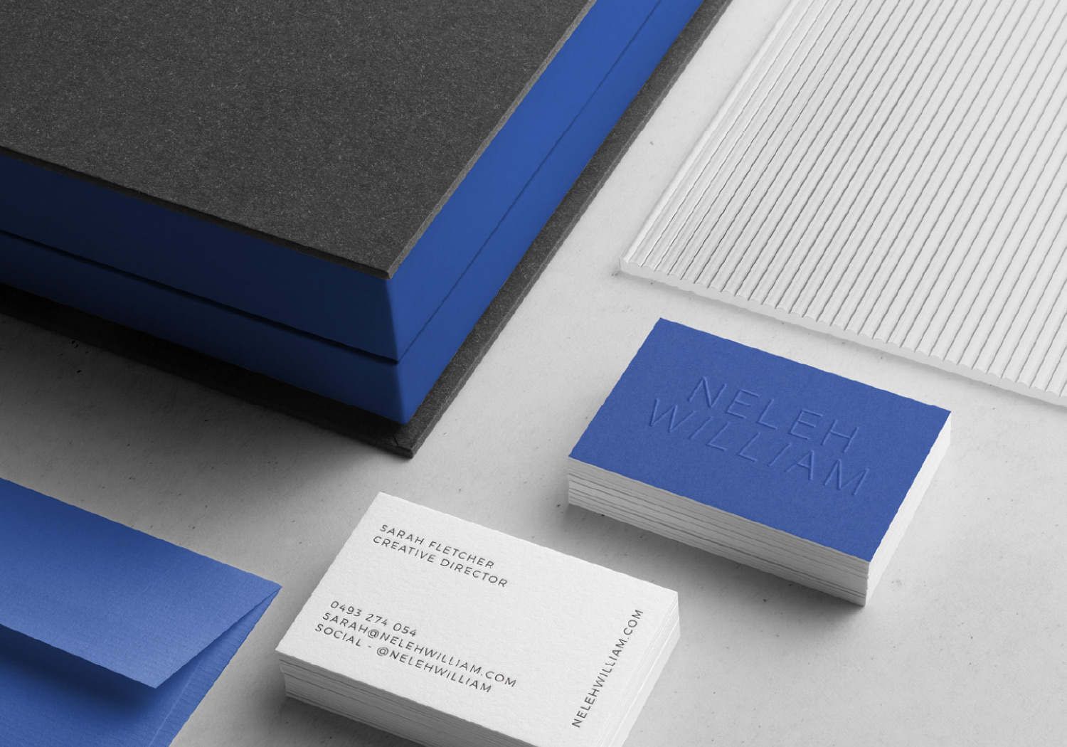 Bright blue, white and charcoal stationery design for Neleh Williams