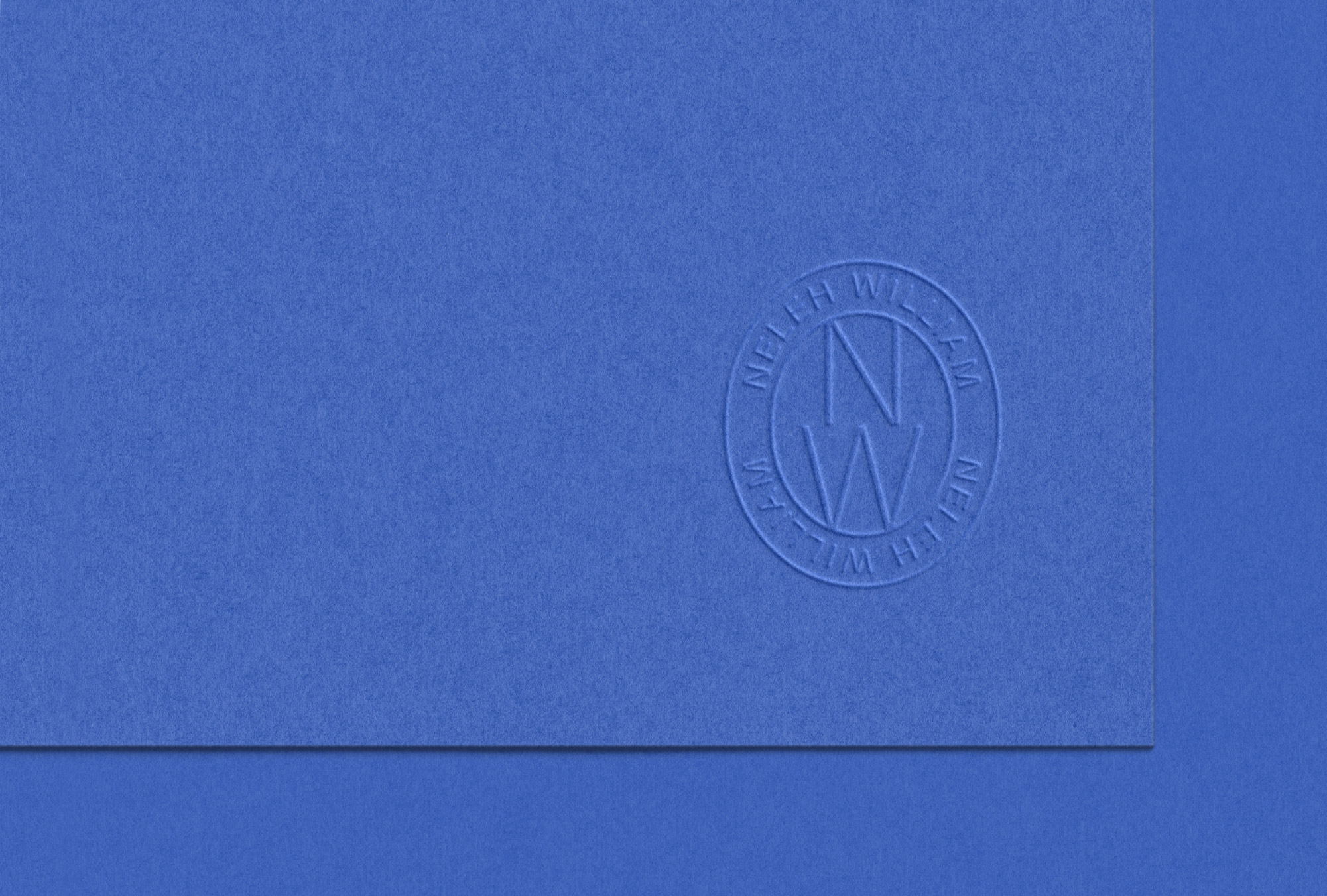 Embossed stamp logo design for Neleh William on electric blue card