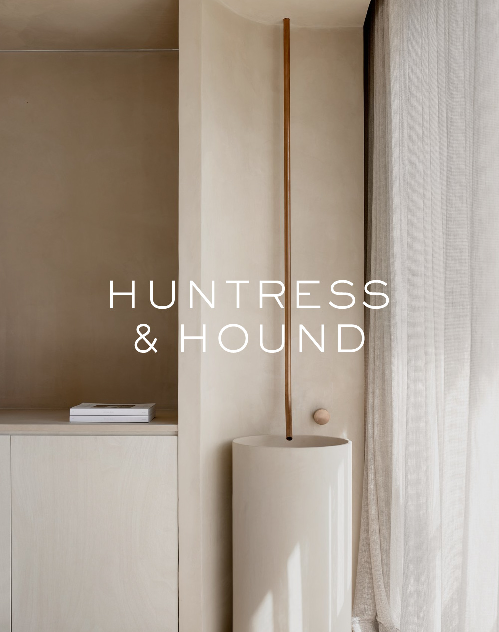 Huntress and Hound logo overlaid over a photo of their studio