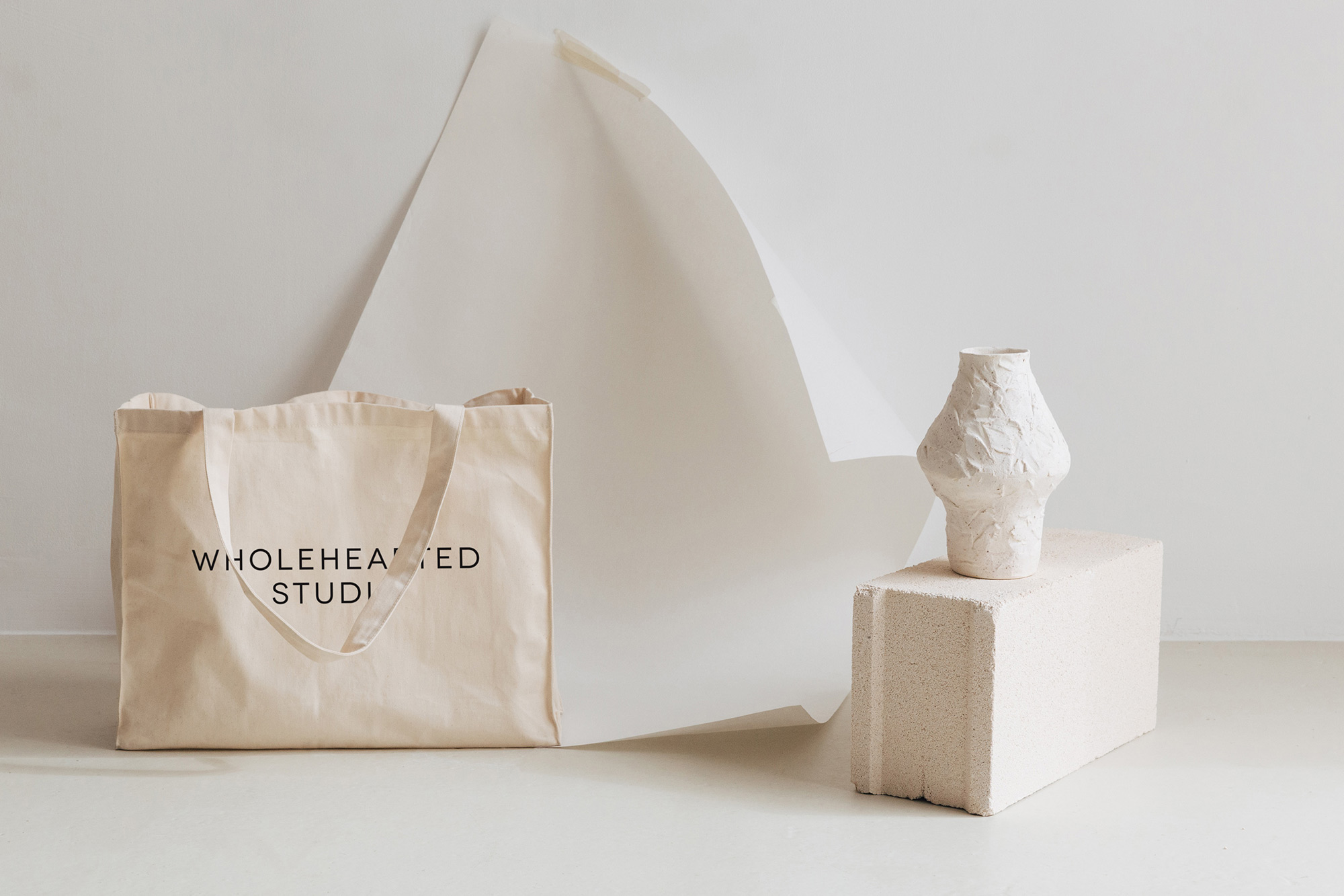 Custom tote bag with Wholehearted Studio logo